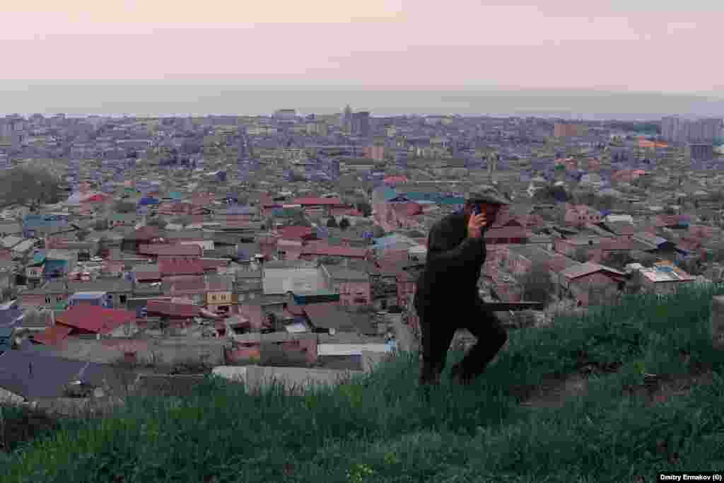 A man climbs a hill overlooking Derbent. After the October 29 airport violence, Rabbi Isakov told a local media outlet, &ldquo;The situation is very difficult in Daghestan, the community is very afraid,&rdquo; and added, &ldquo;It&rsquo;s not clear where to flee to.&quot; &nbsp;