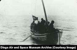 A boat filled with Soviet soldiers and men in civilian clothing who had rowed out to meet the American seaplanes off the Komandirskiye Islands.