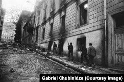 Gunmen in Tbilisi walk near where Sasha Selipanov lived as a child, alongside today's Freedom Square, in late 1991.