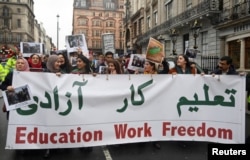 Protesters participate in a rally in support of Afghan women's rights in London. (file photo)