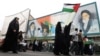 An Iranian woman in Tehran holds a Palestinian flag during a rally in support of Palestinians on October 13. 