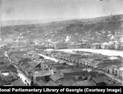 Central Tbilisi photographed when the city’s riverbank was fundamentally different from today. Under Soviet rule in the 1930s many of the city’s riverside structures were demolished and stone embankments were emplaced to hem in the Mtkvari River and prop up highways on both of its banks.