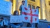 Protesters rally outside the parliament in Tbilisi on May 18.