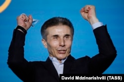 Bidzina Ivanishvili, founder of the governing Georgian Dream party and former prime minister, celebrates exit poll figures showing the political party gaining a majority in the 2020 parliamentary elections.