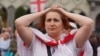 A Georgian demonstrator outside the Caucasus country's parliament on May 28, when lawmakers for the ruling Georgian Dream overrode President Salome Zurabishvili's veto of a controversial "foreign agent" law.