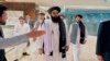 The Taliban-appointed Foreign Minister Amir Khan Muttaqi (center) walks with other officials after arriving in Islamabad for talks with Pakistani officials in May. 