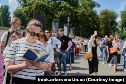 People line up at the entrance to the Book Arsenal Festival in Kyiv on June 1.