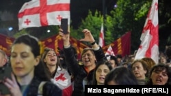 The participants in the May 26 march raised the flashlights on their cell phones and chanted, “No to the Russian law!” and “No to the Russian regime!”