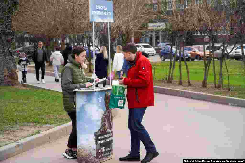 This April 13 photo shows a booth in Moscow offering contracts to those willing to take part in the invasion of Ukraine.