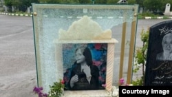 A photo showing damage to the gravestone of Mahsa Amini, who died in police custody in September. 