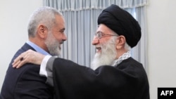 Iranian Supreme Leader Ayatollah Ali Khamenei and Hamas leader Ismail Haniya in 2012.