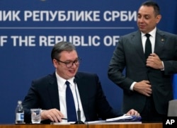 Serbian President Aleksandar Vucic (left) holds a press conference with then-Interior Minister Aleksandar Vulin in Belgrade in 2021.