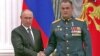 Russian President Vladimir Putin (left) after awarding Irek Magasumov the Hero of Russia medal.