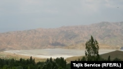 A pool of runoff from the gold-refining process at the Zarafshon mine, which contains cyanide, can be seen from a nearby ridge in May 2023. Villagers have complained to the government that the emissions are harmful to them and the environment.