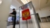 The Central Election Commission urged police to increase security at polling stations, which are open from March 15-17 for Russia's presidential election.