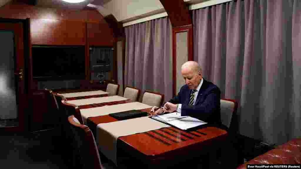 U.S. President Joe Biden is seen riding a train on the day of his surprise visit to Ukraine. He traveled by train from Poland to Kyiv for almost 10 hours.