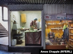 A refugee from Nagorno-Karabakh makes bread in Armenia.