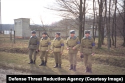 Ukrainian soldiers seen during an "inspection team visit" to a WMD production site in 1995