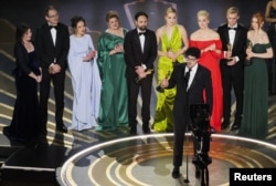 Director Daniel Roher speaks while accepting the Oscar for Best Documentary Feature Film in Los Angeles on March 12.