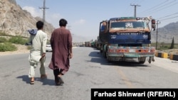 Vehicles wait to pass through the Torkham border crossing earlier this month