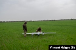 Soldiers from 22nd Mechanized Brigade set up equipment for the launch of a Poseidon H10 surveillance drone.