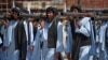 Taliban militants take part in a military parade at Bagram airfield north of Kabul to celebrate the third anniversary of the Taliban's takeover of Afghanistan on August 14.