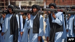 Taliban militants take part in a military parade at Bagram airfield north of Kabul to celebrate the third anniversary of the Taliban's takeover of Afghanistan on August 14.