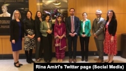 Tom West (center), the former U.S. special representative for Afghanistan, poses with Malala Yousofzai (center) in Washington. (file photo)