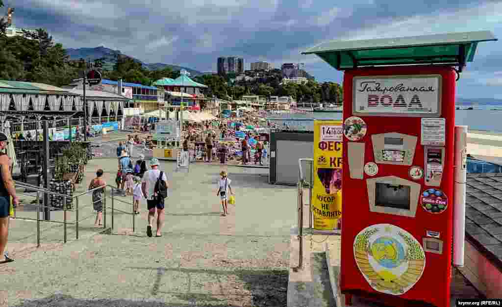 Tourists enjoy the sights along the beach at Alushta, located on the Crimean Peninsula&#39;s southern coastline. The peninsula, which is internationally recognized as Ukrainian territory, has been occupied by Russia since its illegal annexation and takeover in 2014. &nbsp;