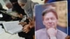 Supporters in Pakistan hold a photo of imprisoned former Prime Minister Imran Khan (file photo).