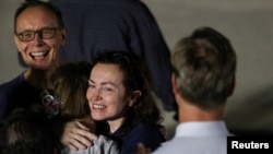 RFE/RL journalist Alsu Kurmasheva is reunited with her family at Joint Base Andrews, outside of Washington, D.C., on August 1. 