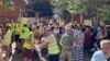 At a distribution center for humanitarian aid in the southern Russian city of Kursk, workers load and unload supplies for people who have fled ahead of Ukraine's incursion into the region. 