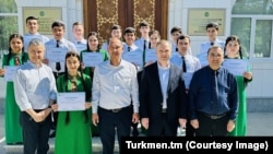 An official photograph shows children from Turkmen orphanages graduating from vocational training courses in May.