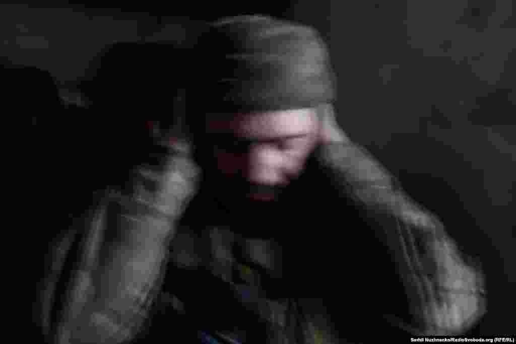 A Ukrainian soldier photographed as his position was being shelled in May 2023.