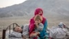 Afghan refugees settle in a camp near the Pakistan-Afghanistan border in Torkham, Afghanistan, after fleeing Pakistan on November 4.