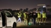 Israeli soldiers await the arrival of hostages by helicopter near Tel Aviv on November 30. Seniors, women, and children have been the priority so far in negotiations for the release of hostages.