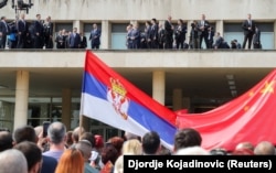 Chinese leader Xi Jinping looks on as Serbian President Aleksandar Vucic speaks from the Palace of Serbia during a two-day state visit to Belgrade on May 8.