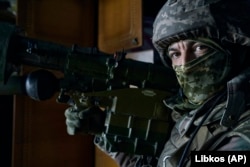 A Ukrainian soldier holds an Igla rocket launcher in Bakhmut on April 26.