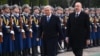 Kazakhstan's Qasym-Zhomart Toqaev (left) is welcomed to Baku by Azerbaijani President Ilham Aliyev on March 11.