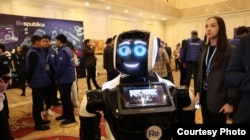 A robot read out parts of the newly registered Respublica party's manifesto at a March 15 campaign event in Astana.