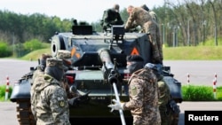 Soldiers participate in maintenance training on Leopard 1A5 tanks for Ukrainian soldiers, at the German Army's Bundeswehr base in Klietz, Germany, in May 2023.
