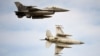 Romanian air force F-16 fighter jets fly above the Baza 86 military air base. (file photo)