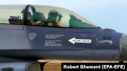 A Romanian F-16 jet pilot at the opening ceremony for the European F-16 Training Center at a military air base in southeastern Romania.