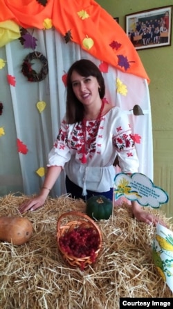 Former student Natalya Konukh at the Harant school, in its now-ruined building in Lysychansk