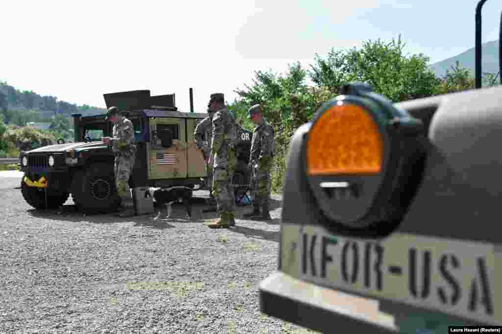 U.S. members of the NATO-led peacekeeping force stand near the border at Jarinje on September 1. Major General Ferenc Kajari, commander of NATO&#39;s peacekeeping mission in Kosovo, downplayed fears of violence over the reignited license issue, telling Reuters: &quot;We don&#39;t see any kind of indication even of a preparation for a war.... Those who think responsibly, they should not talk about war.&rdquo;