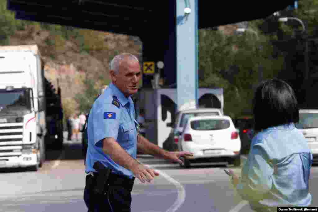 A Kosovar police officer works at the Jarinje border crossing from northern Kosovo into Serbia on September 1. Kurti called the move more &quot;nothing more or less than an expression of the exercise of [Kosovar] sovereignty&rdquo; and claimed the Serbian-issued plates being used by Serbs in Kosovo &ldquo;are the legacy of the Milosevic regime,&rdquo; referring to Serbia&#39;s late wartime leader Slobodan Milosevic.