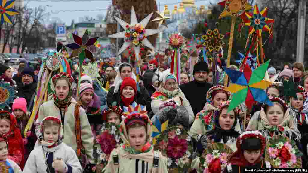 Children take part in a Christmas procession in Kyiv on December 25.&nbsp;