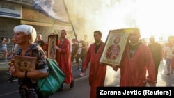 People march during a protest against the international LGBT event EuroPride in Belgrade on August 28.