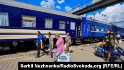 Ukrainians board an evacuation train in Pokrovsk, Donbas, on August 7. Russian soldiers have reportedly taken people at gunpoint from trains and buses to filtration centers.