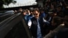 Former Prime Minister Imran Khan (center) leaves the High Court in Islamabad on August 31.